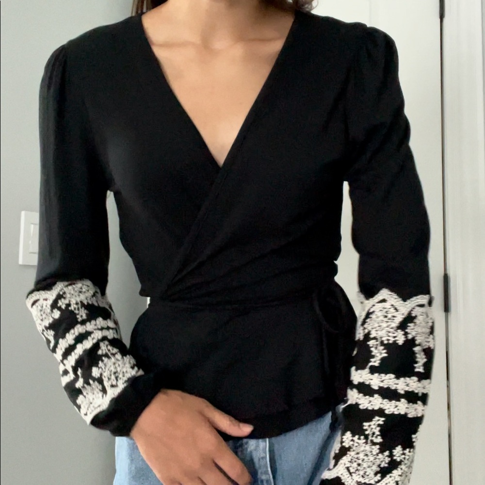 Francesca’s wrap around black long sleeve top
